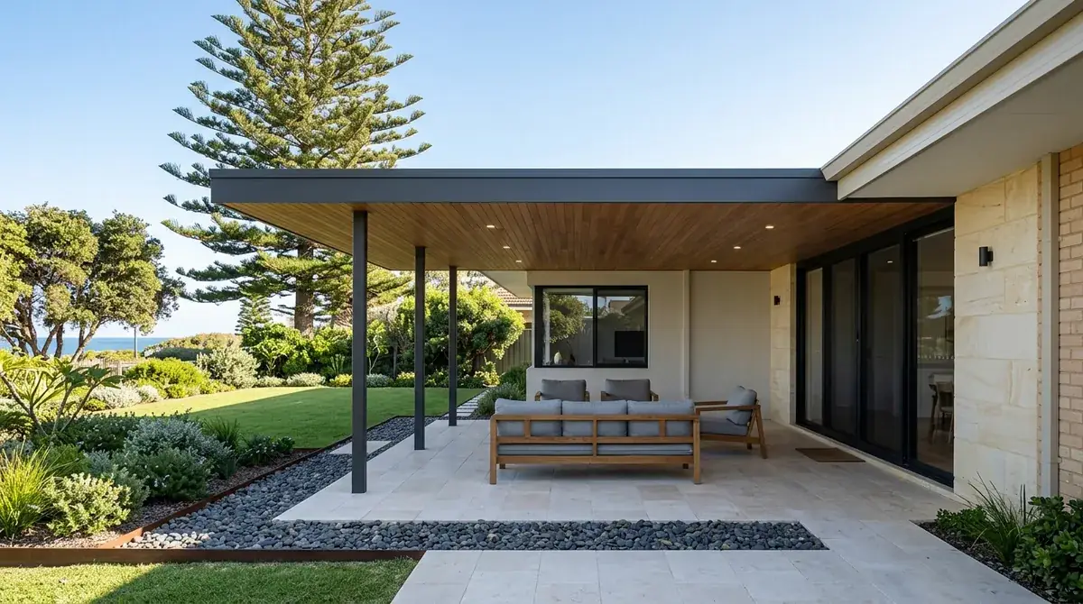 A flat patio roof running level with the long horizontal fascia of a mid-century City Beach house, wide eaves carried straight through