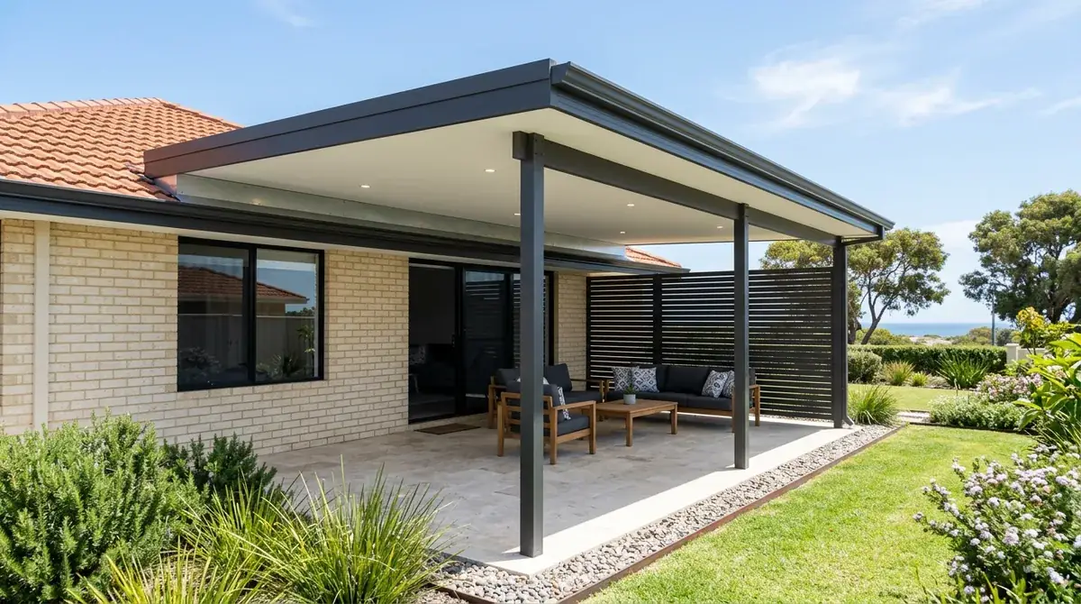 A flat patio roof on a 1990s Warnbro brick-and-tile house, stainless fixings and the open side turned away from the south-west sea breeze.