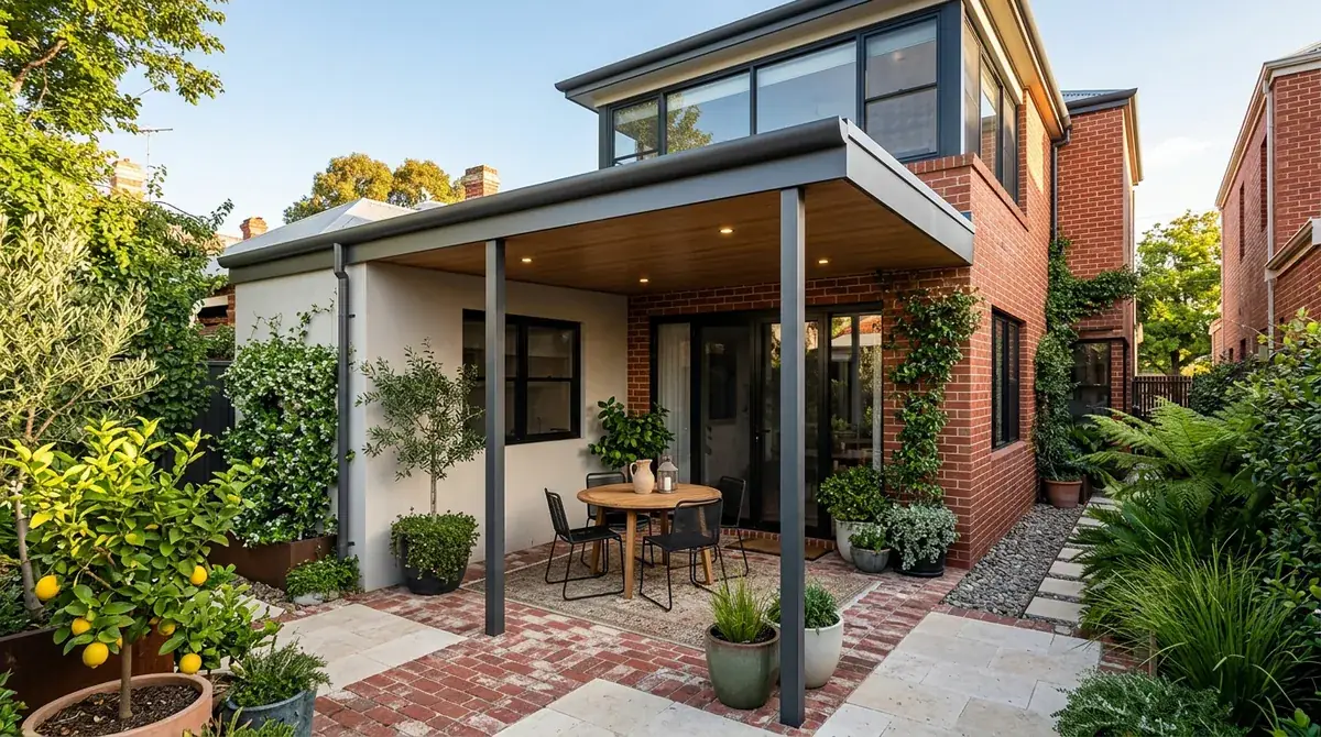A flat patio roof filling a small Subiaco courtyard, fixed to the rendered wall of a two-storey rear addition behind a character cottage